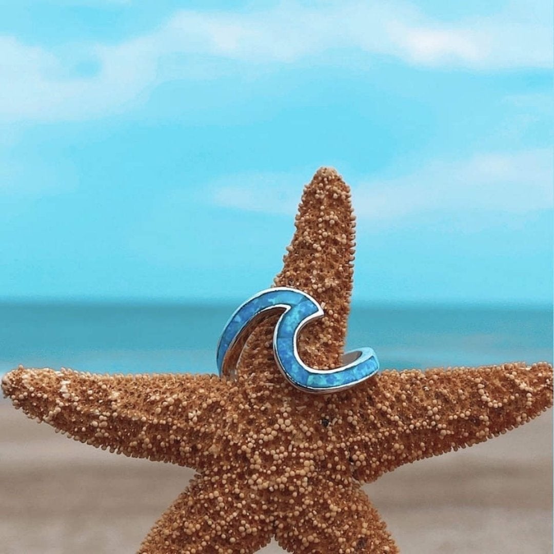 Silver wavy ring with blue opal