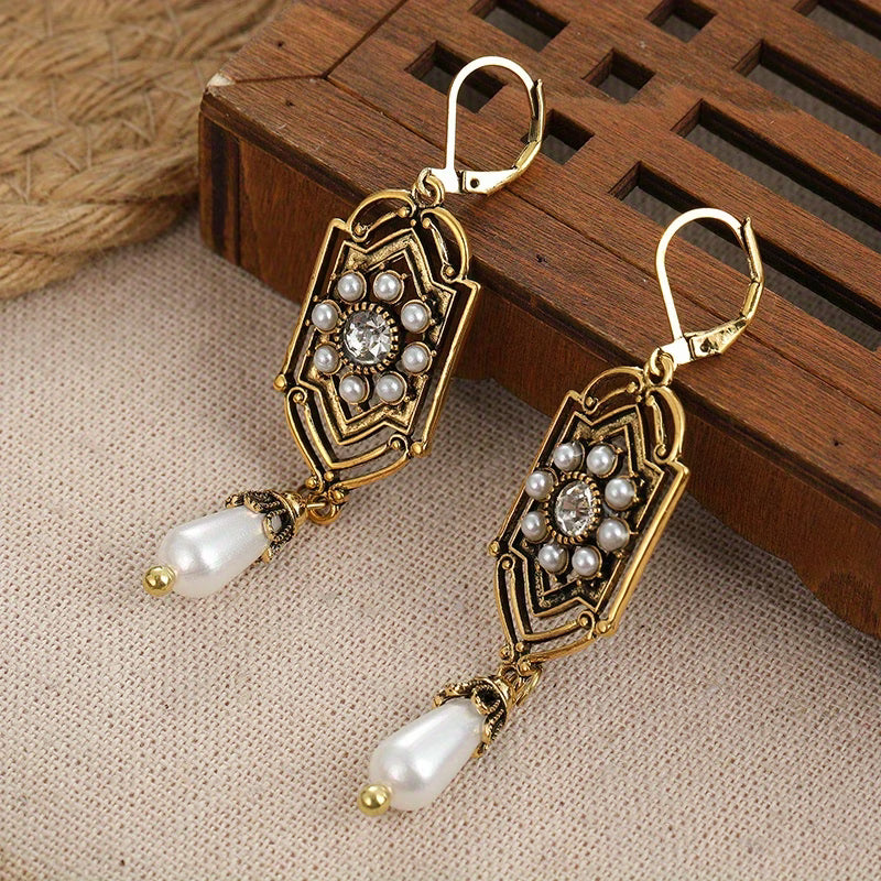 Vintage gold earrings with inset pearl