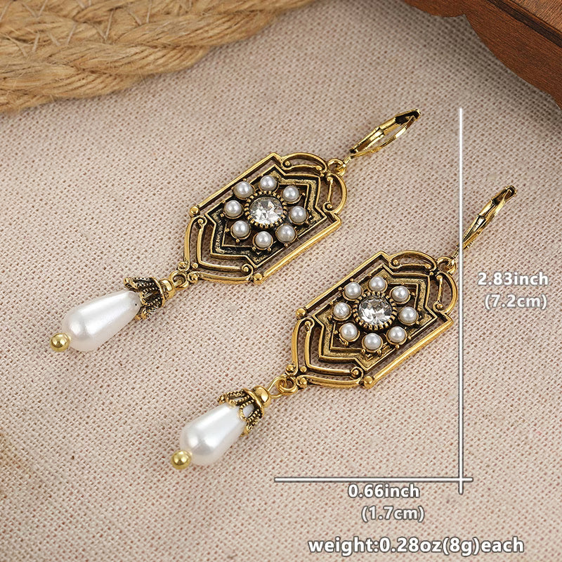 Vintage gold earrings with inset pearl