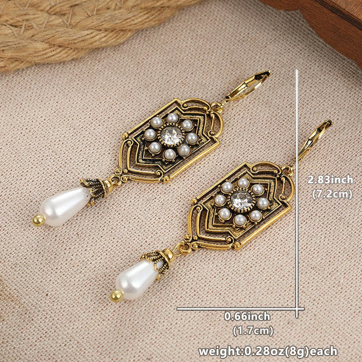 Vintage gold earrings with inset pearl