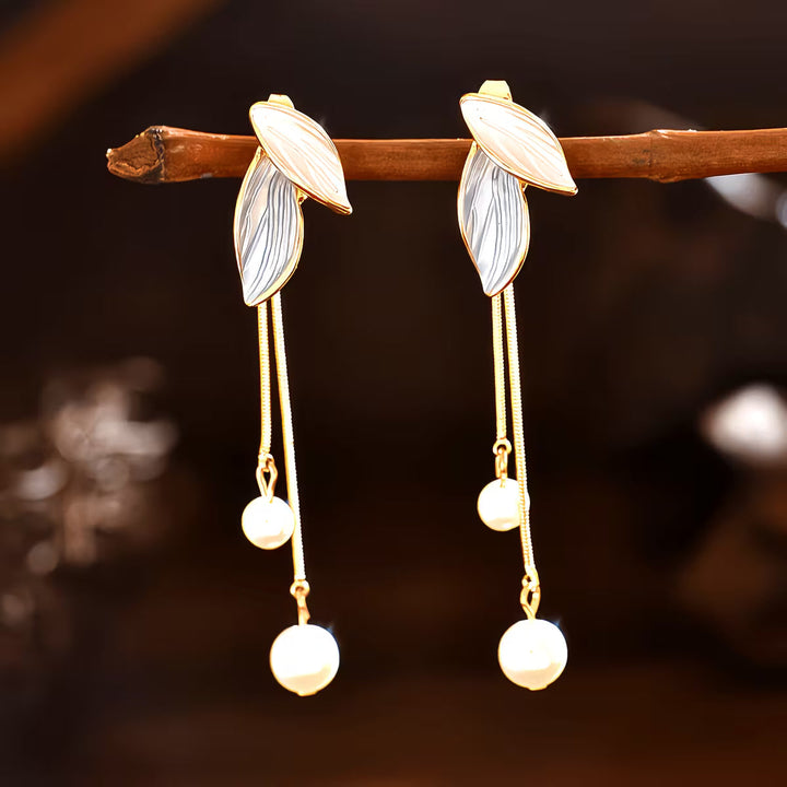 Long beaded leaf earrings