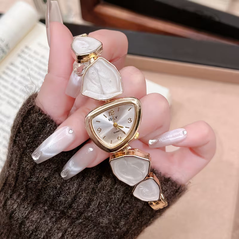 Gold watch with turquoise stone