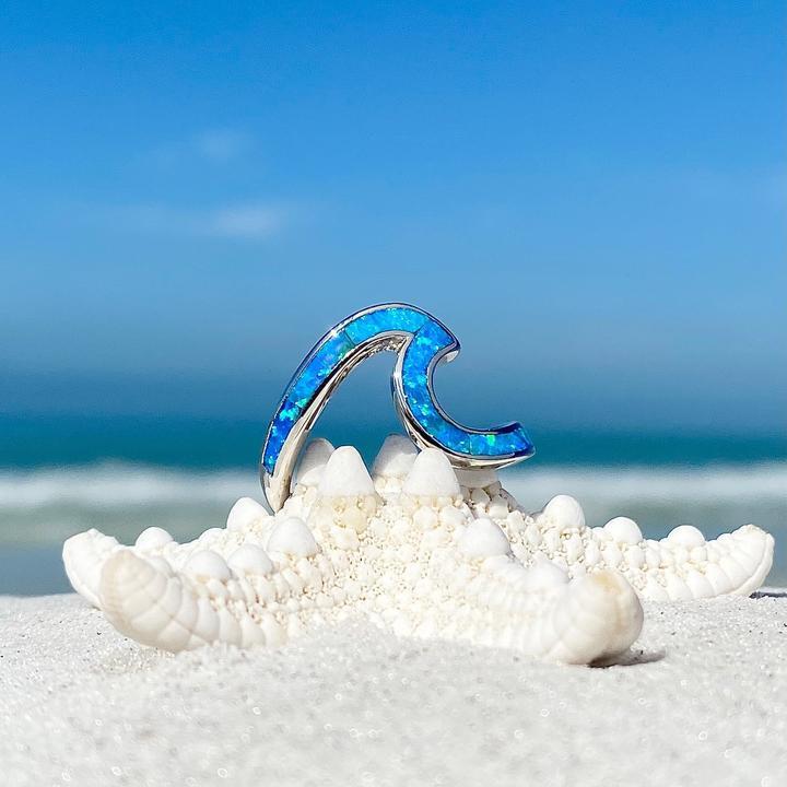 Silver wavy ring with blue opal