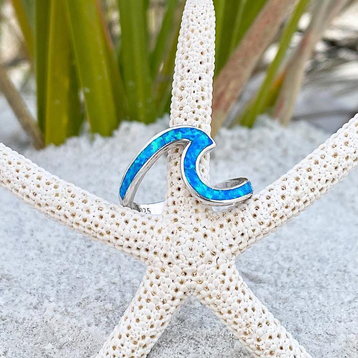 Silver wavy ring with blue opal