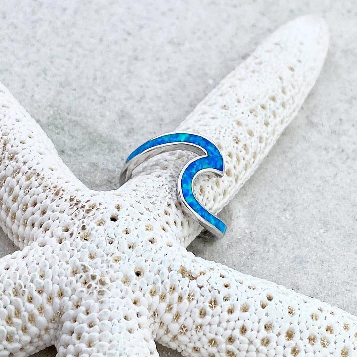 Silver wavy ring with blue opal