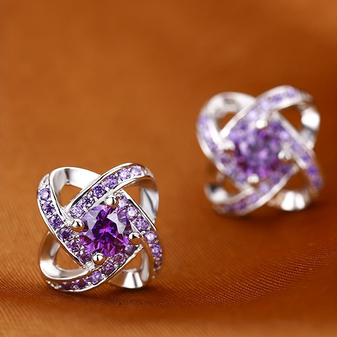 Earrings with purple clover