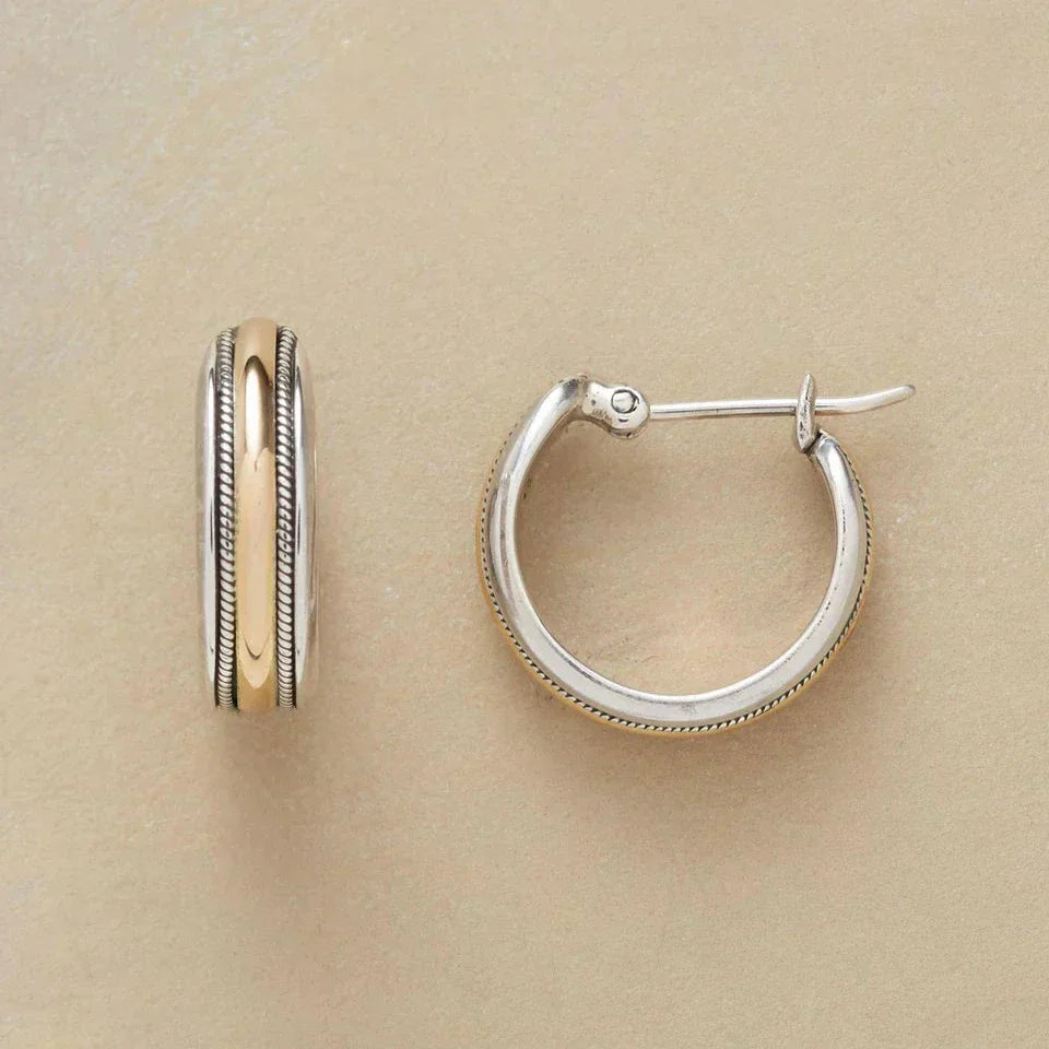 Silver hoop earrings with a gold line
