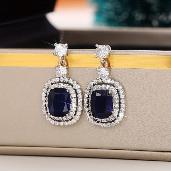 Oval Sapphire Earrings with Zirconia Pavé