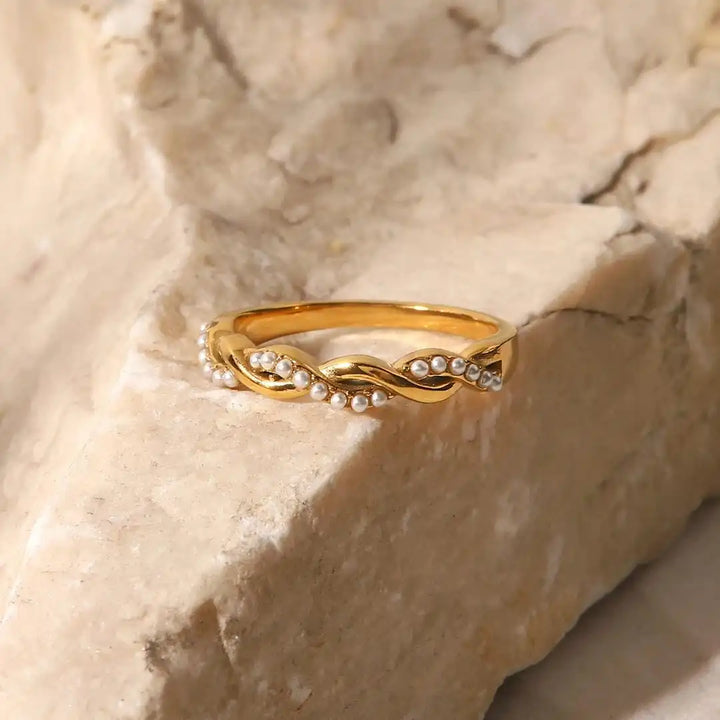 Delicate golden intertwined pearl stack ring