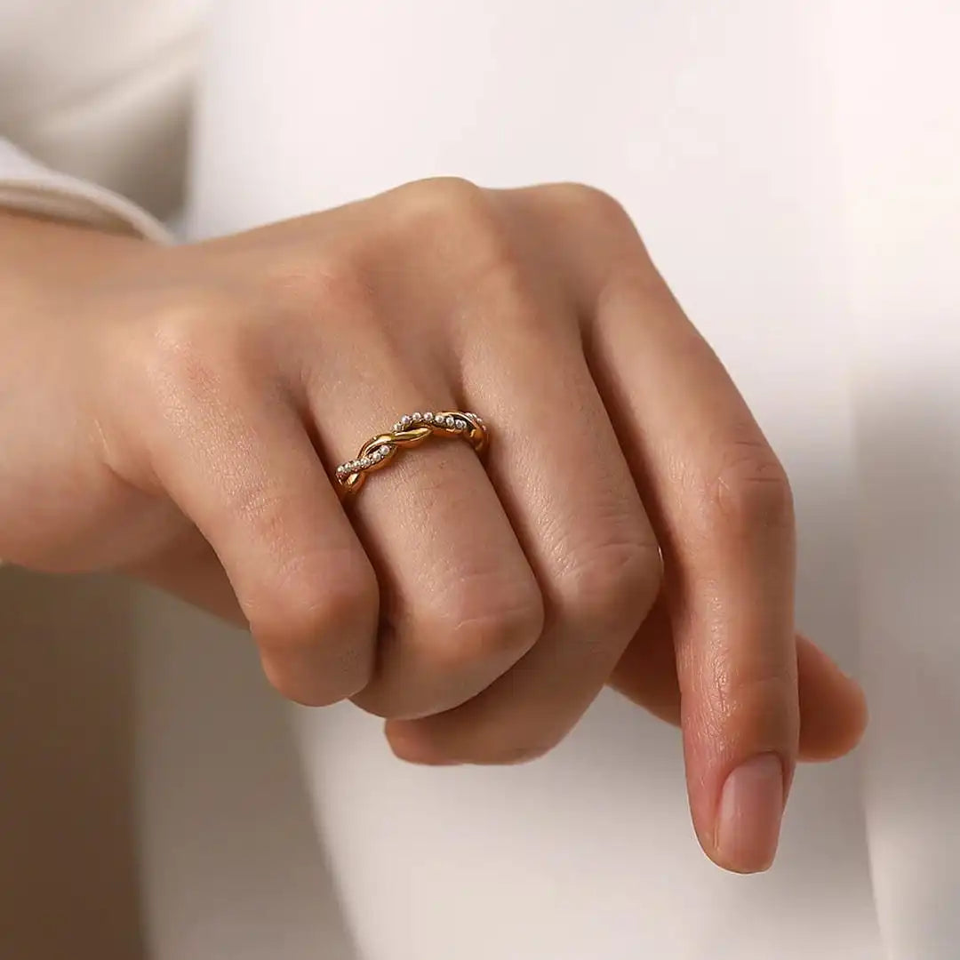 Delicate golden intertwined pearl stack ring