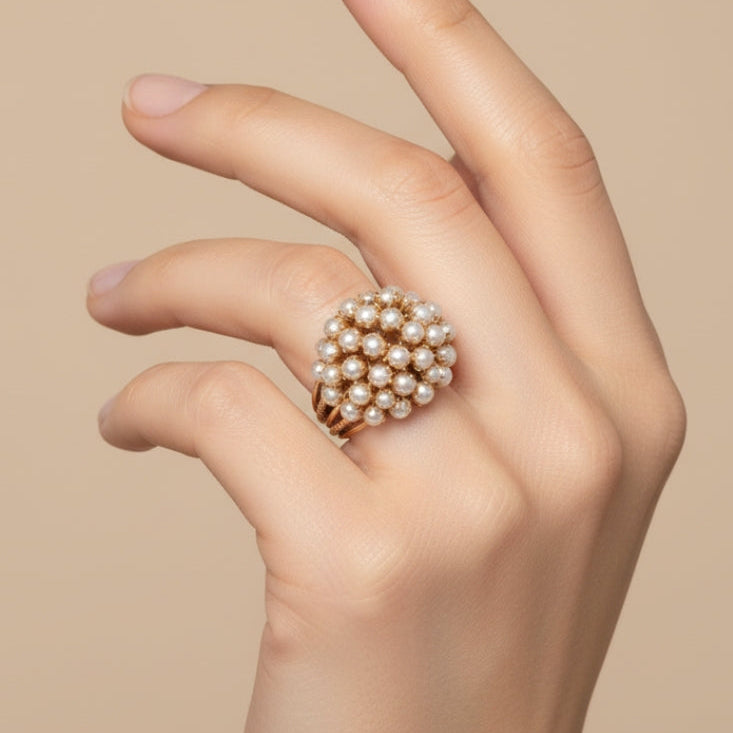 Classic gold ring with an inset pearl