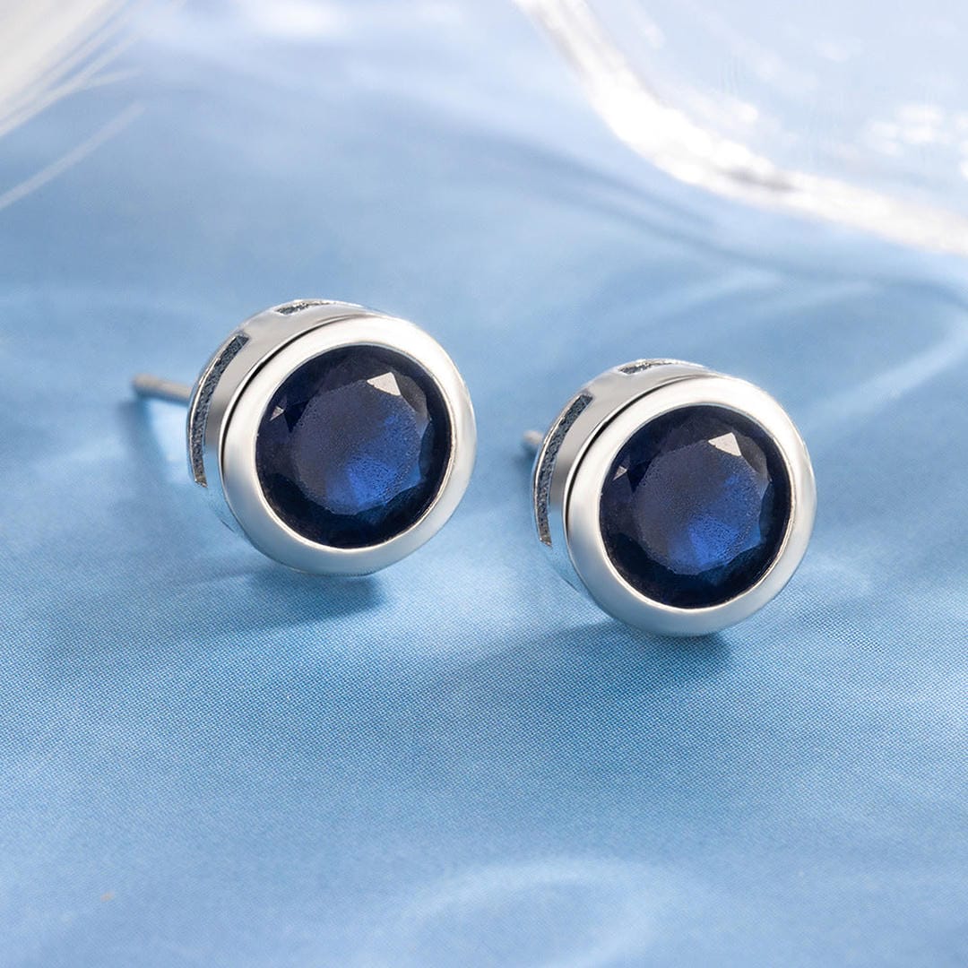 Sapphire stud earrings with bezel setting