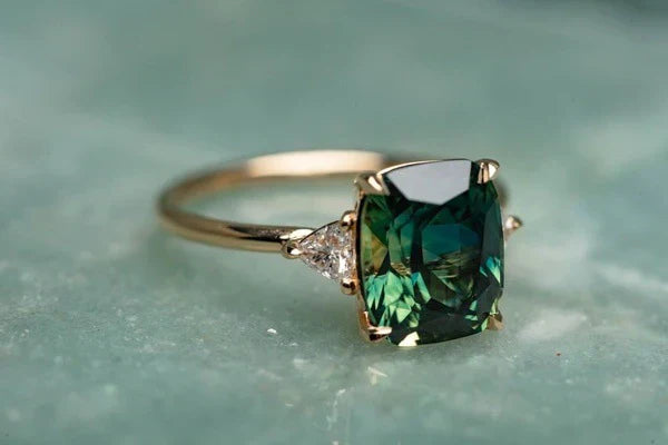 Vintage-inspired gold ring with a green gemstone