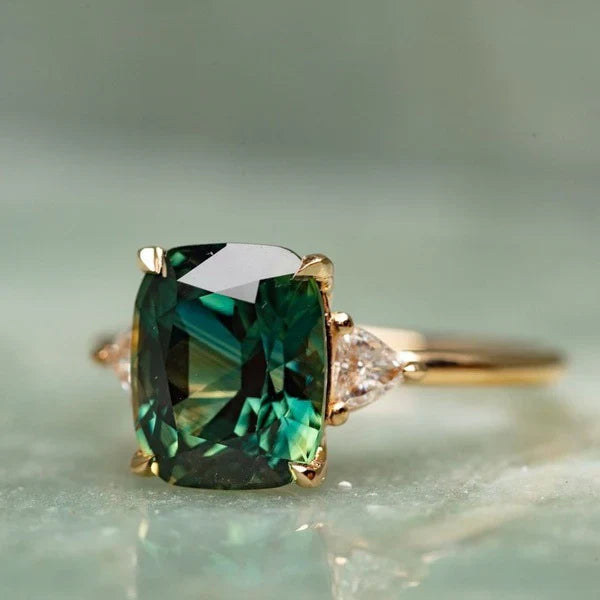 Vintage-inspired gold ring with a green gemstone