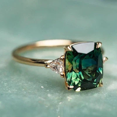Vintage-inspired gold ring with a green gemstone