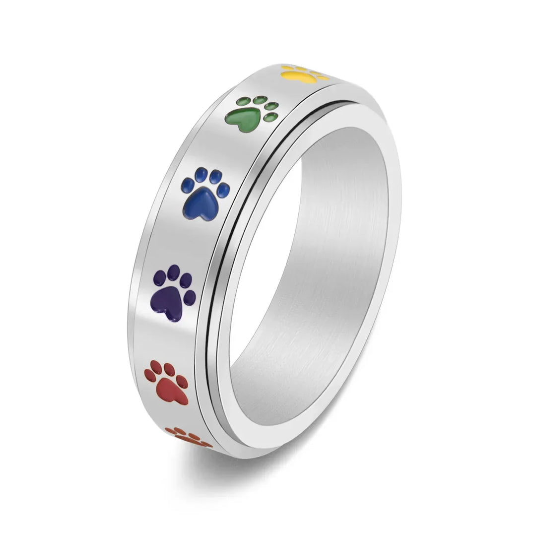 Rotating stress-reducing paw ring - stainless steel with rainbow paws