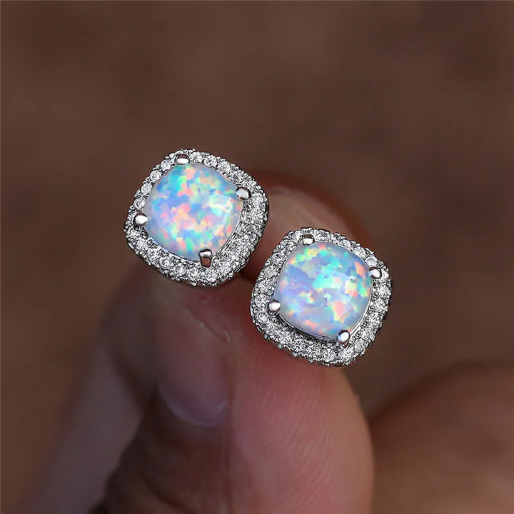 Elegant round silver stud earrings with white fire opal - Haller