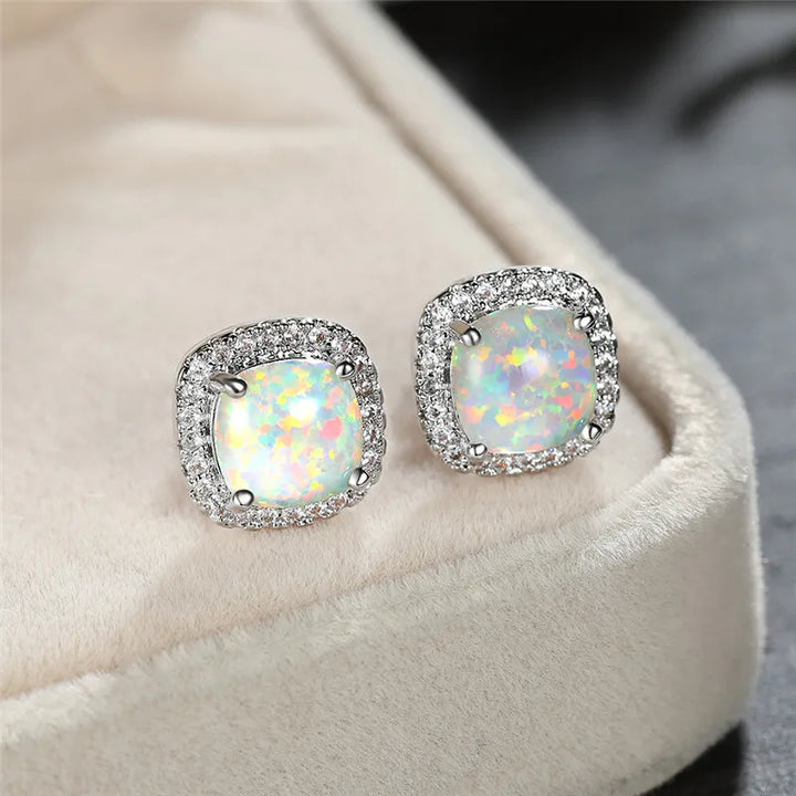 Elegant round silver stud earrings with white fire opal - Haller