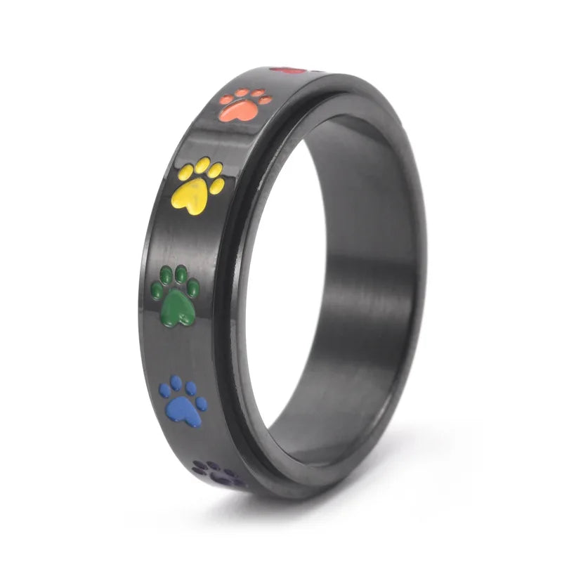 Rotating stress-reducing paw ring - stainless steel with rainbow paws