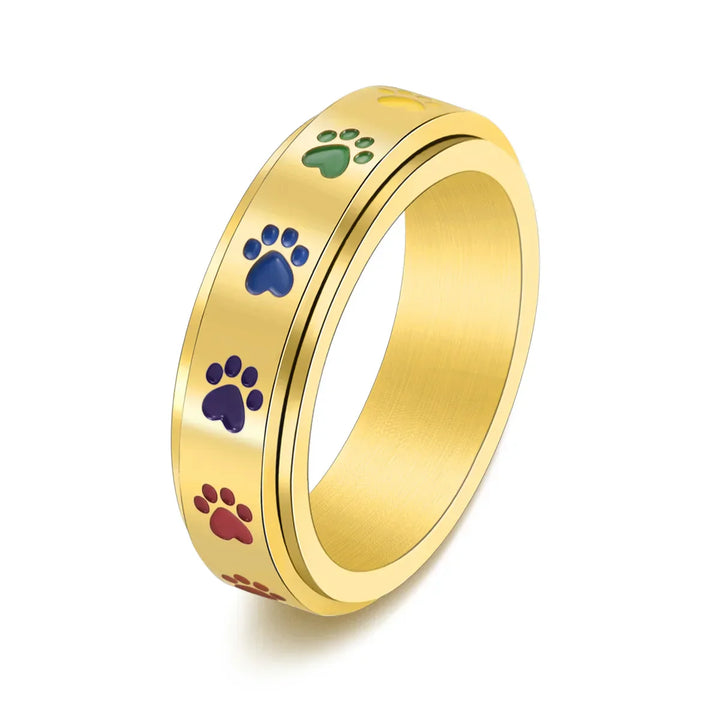 Rotating stress-reducing paw ring - stainless steel with rainbow paws