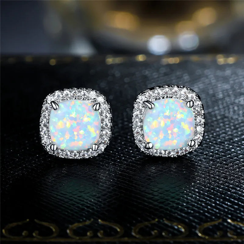 Elegant round silver stud earrings with white fire opal - Haller