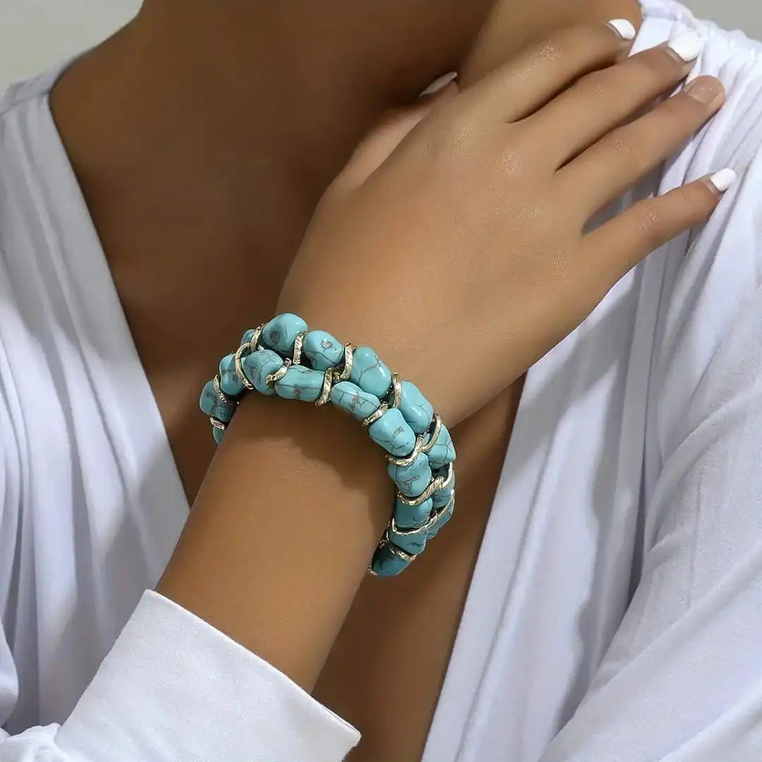 Braided gold bracelet with turquoise stone