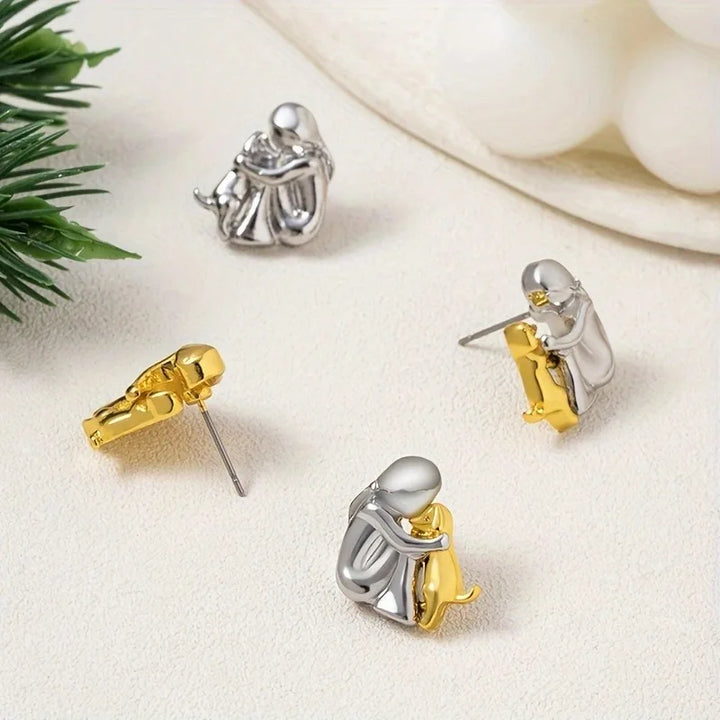 Two-tone silver and gold huggie earrings