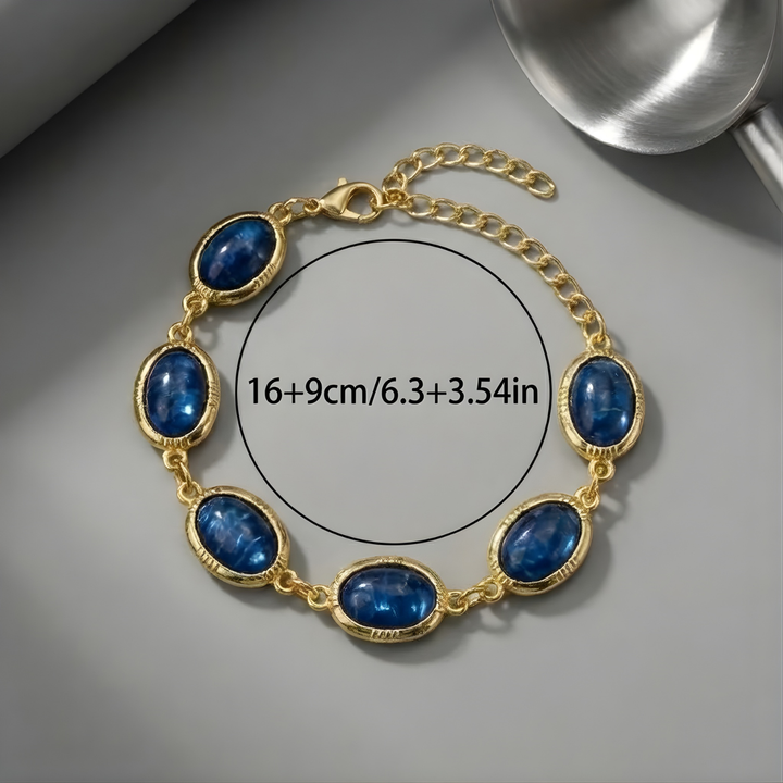 Charming gold bracelet with a blue stone