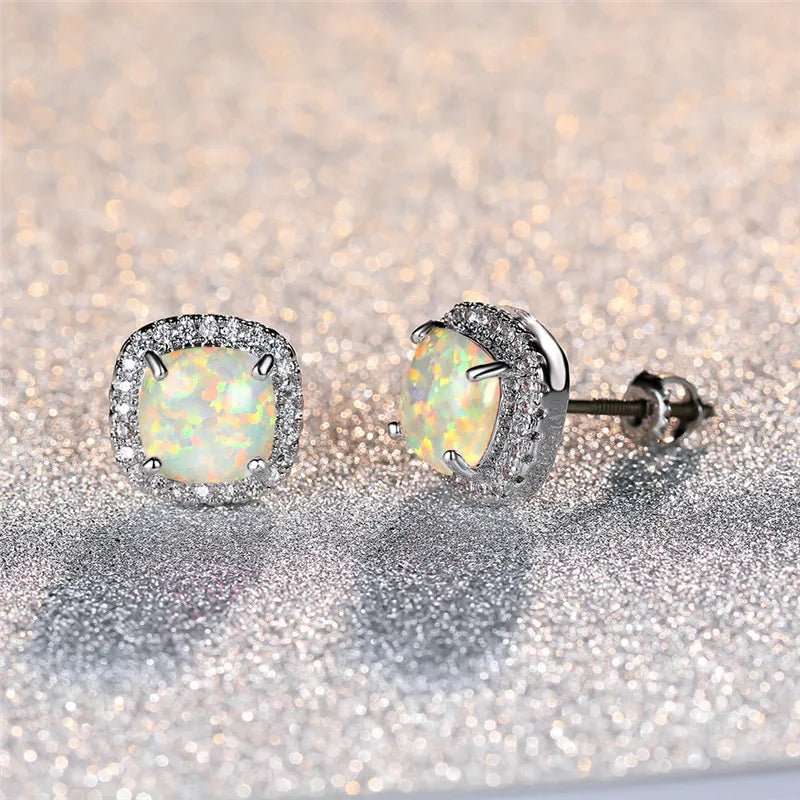 Elegant round silver stud earrings with white fire opal - Haller