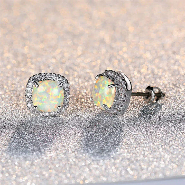 Elegant round silver stud earrings with white fire opal - Haller