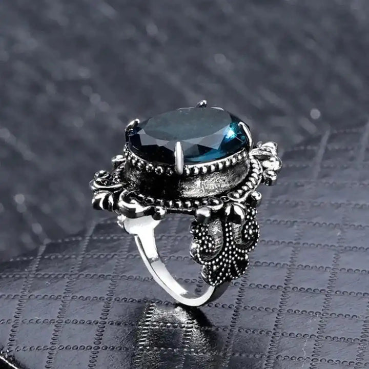 Vintage silver oval ring with blue zirconia