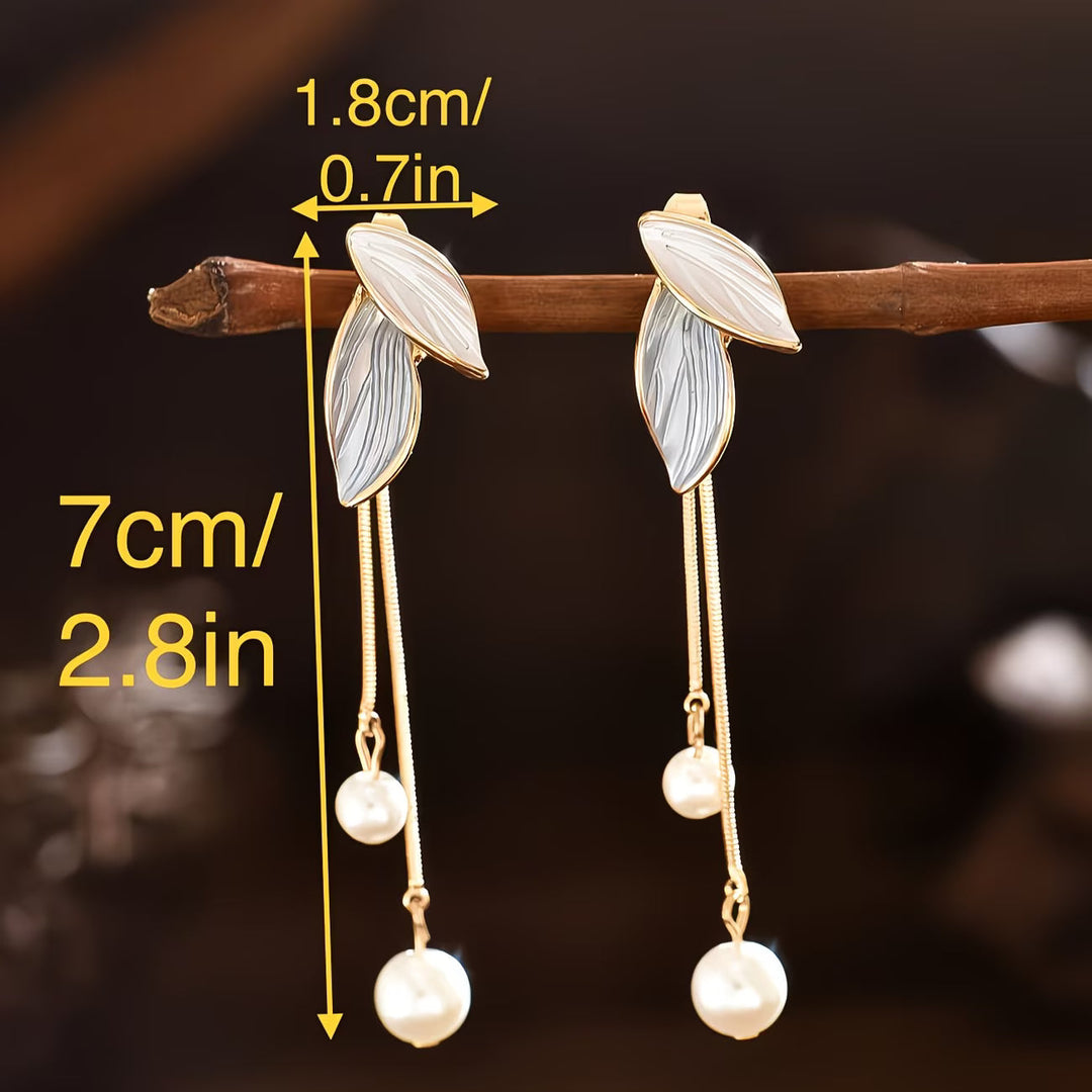 Long beaded leaf earrings