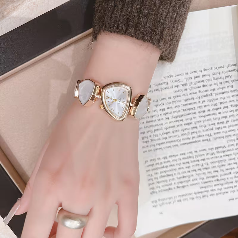 Gold watch with turquoise stone