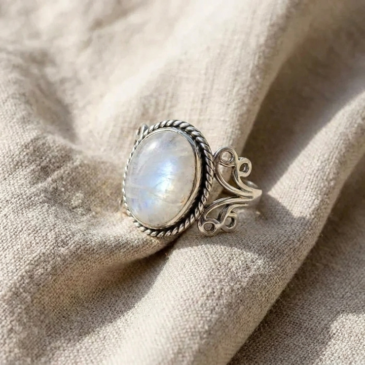 Oval moonstone ring with decorative band