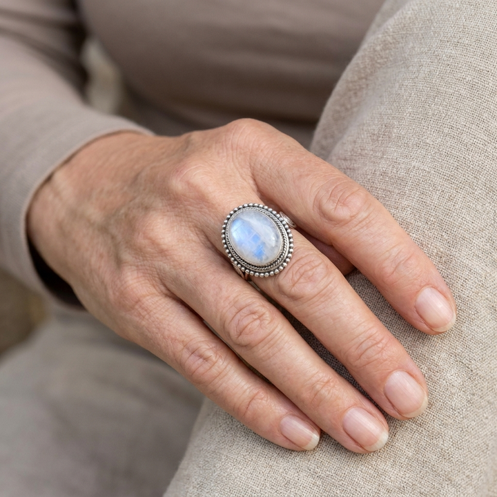 Ring with oval white gemstone