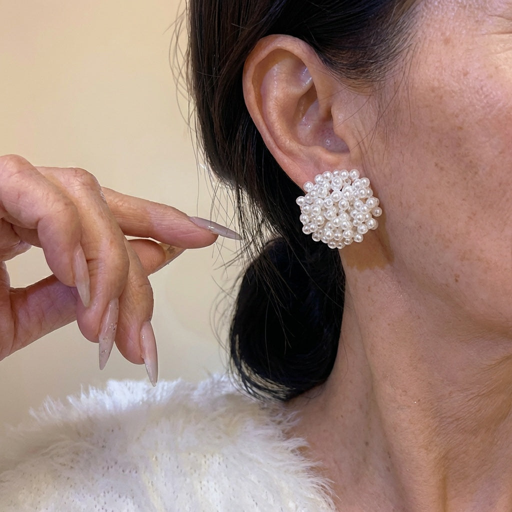 Classic earrings with an inset pearl